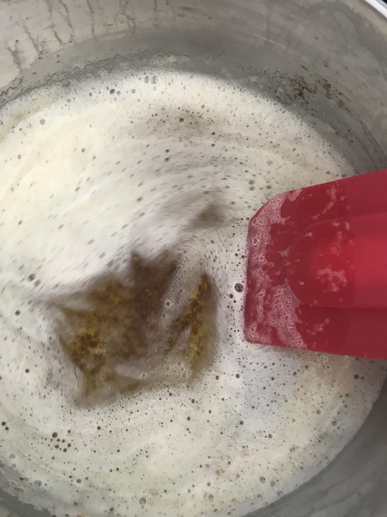 a sauce pan with butter browning and foam