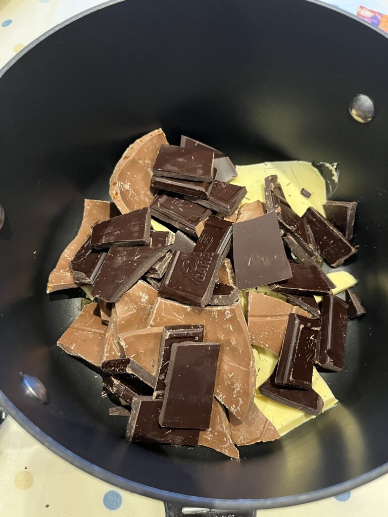 butter, chocolates and golden syrup in a pan to be melted over a medium heat