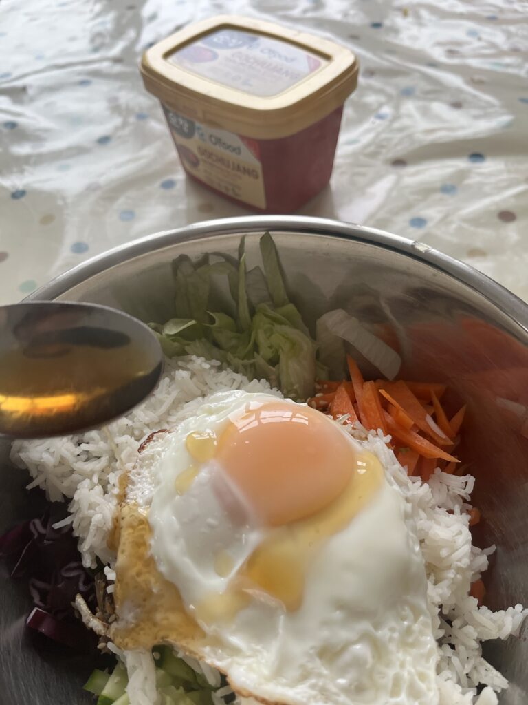 sesame seed oil on the bibimbap egg